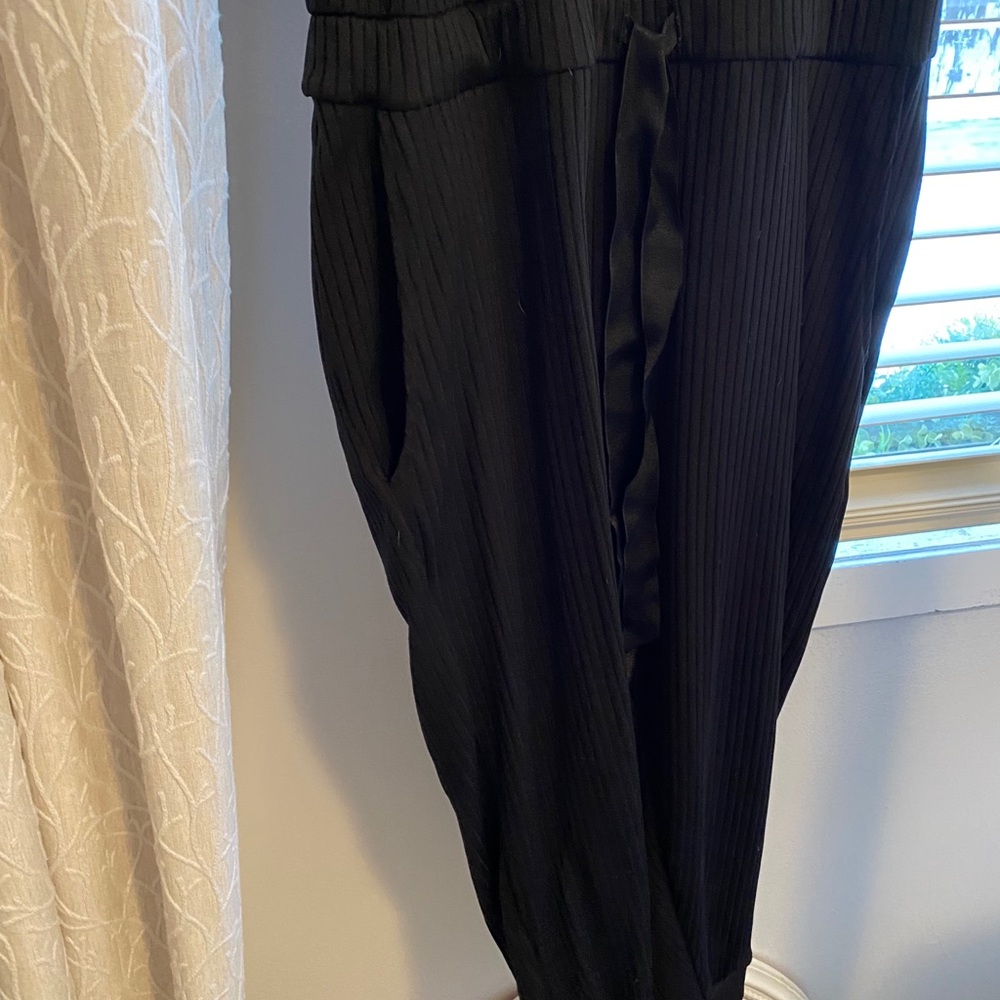 Black cuffed jumpsuit with waist tie...